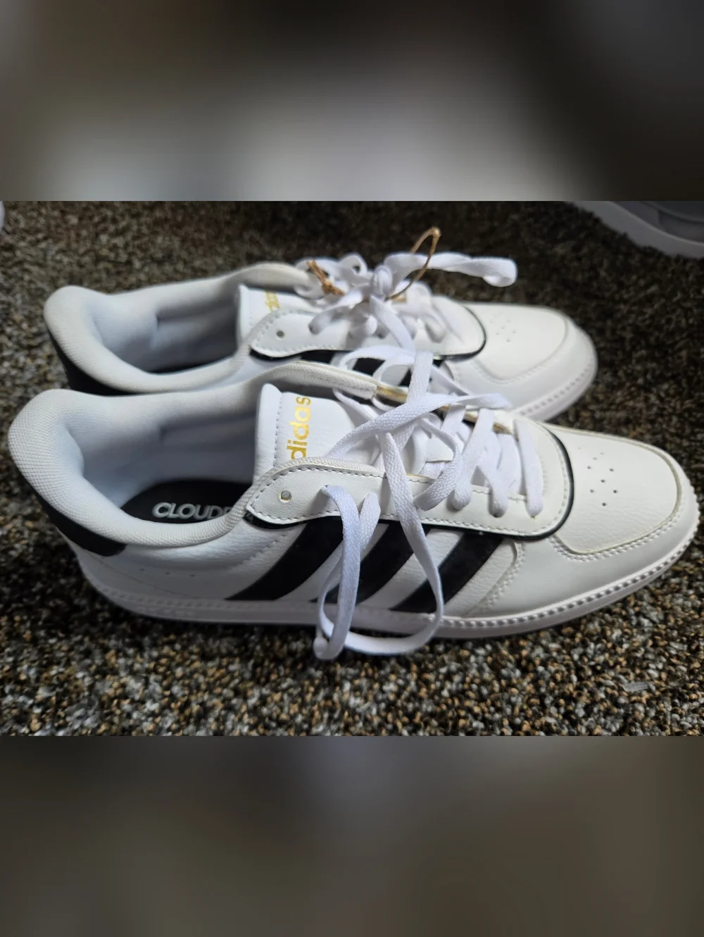 adidas Women’s White Sneakers with Black Stripes and Gold Accents
